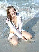 Adorable teenie Josie posing without panties on the beach